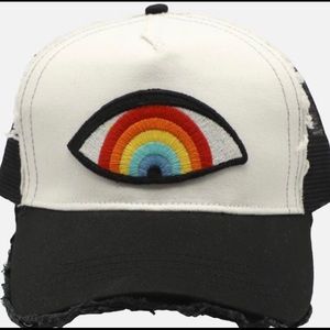 Lauren Moshi Rainbow Eye trucker hat.